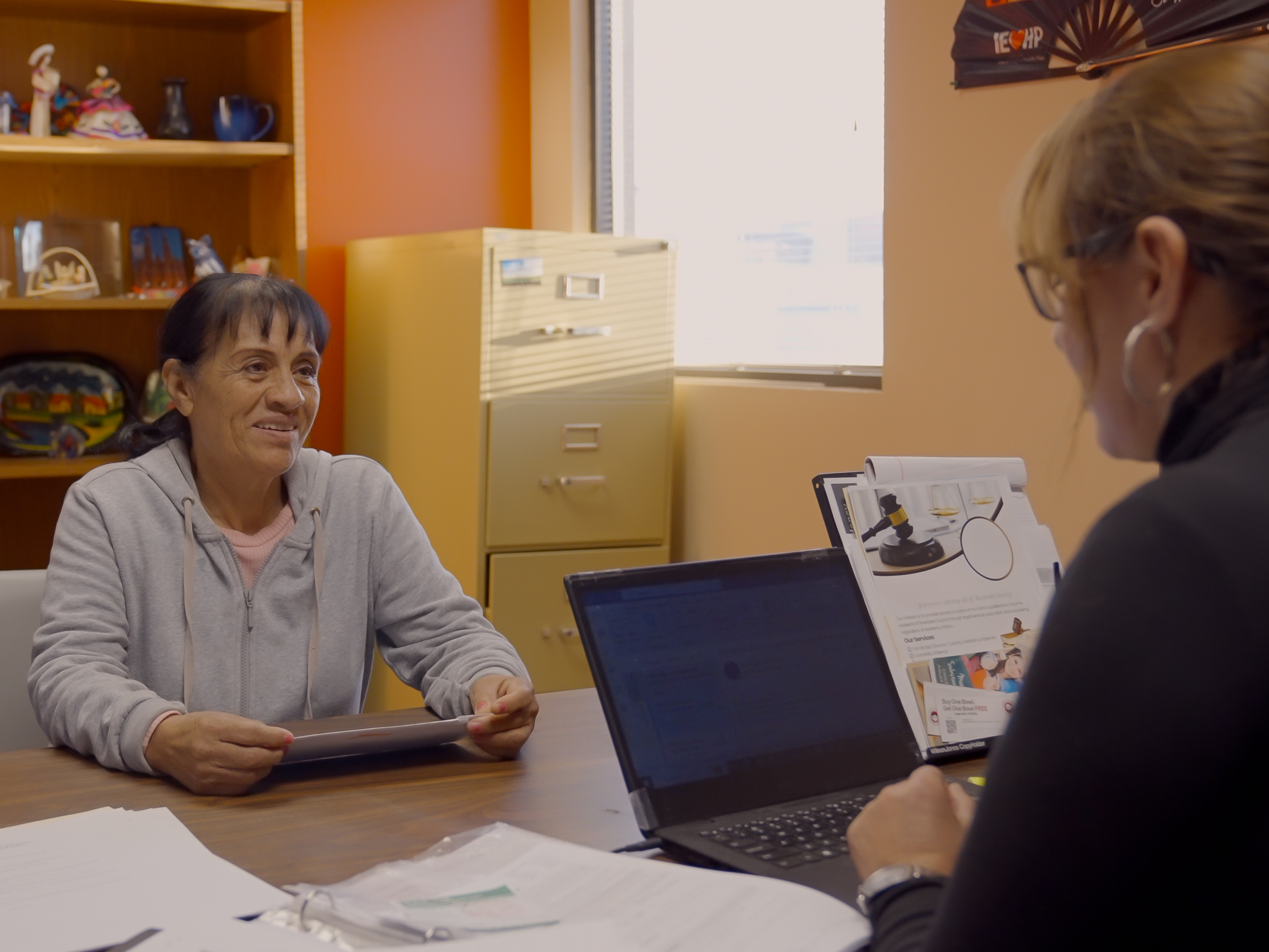 client discusses her case with CRLA Coachella staff member