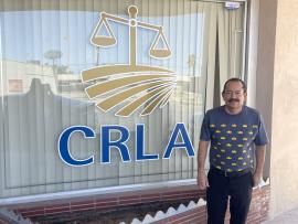A client stands in front of the CRLA El Centro office
