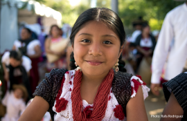 a child smiles at the camera