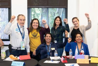 CRLA staff and board stand for group photo during a retreat session
