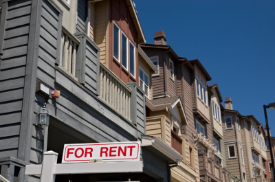 Housing complex with a for rent sign in front 