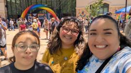 Three people smile during Pride 2026 celebration in Oakdale, California