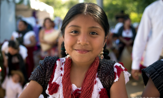 a child smiles at the camera