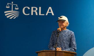 Maurice "Mo" Jourdane speaking at CRLA's 50th anniversary celebration of the El Cortito victory